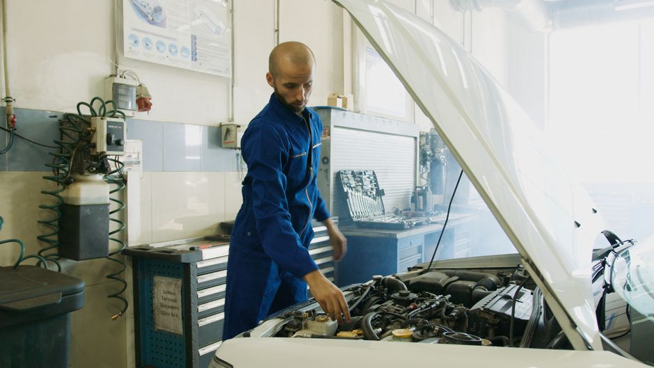 Professionals reviewing financial graphs and charts during a meeting.
